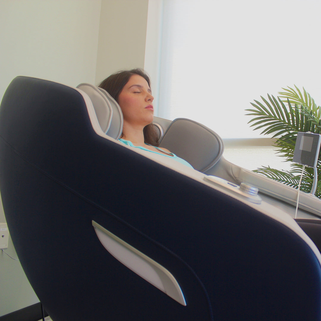 Woman relaxing in R8375 2D Massage chair.