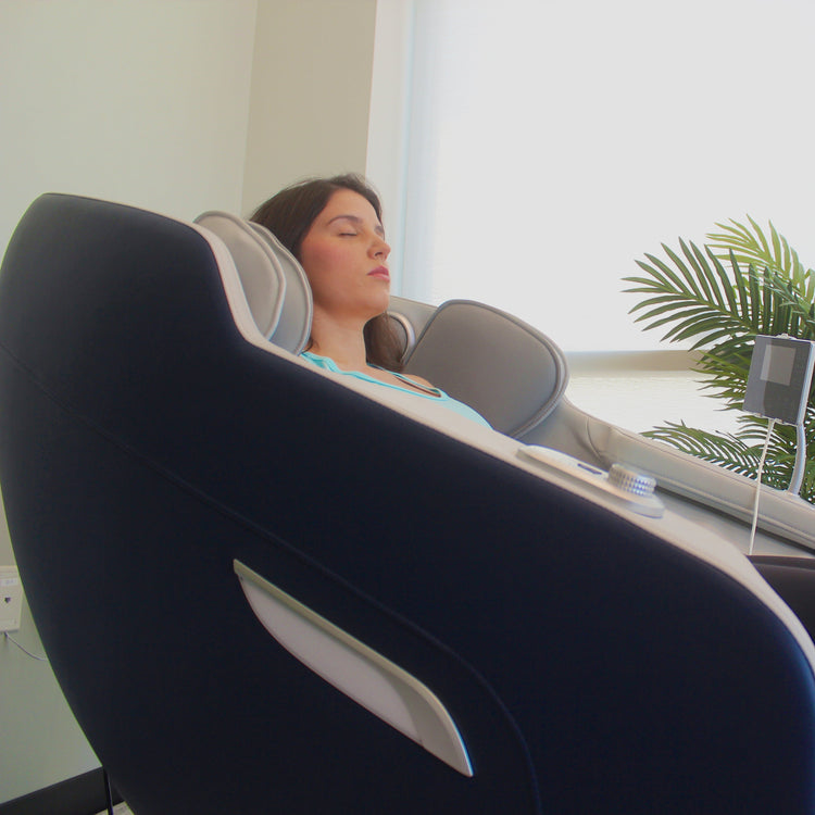 Woman relaxing in R8375 2D Massage chair.